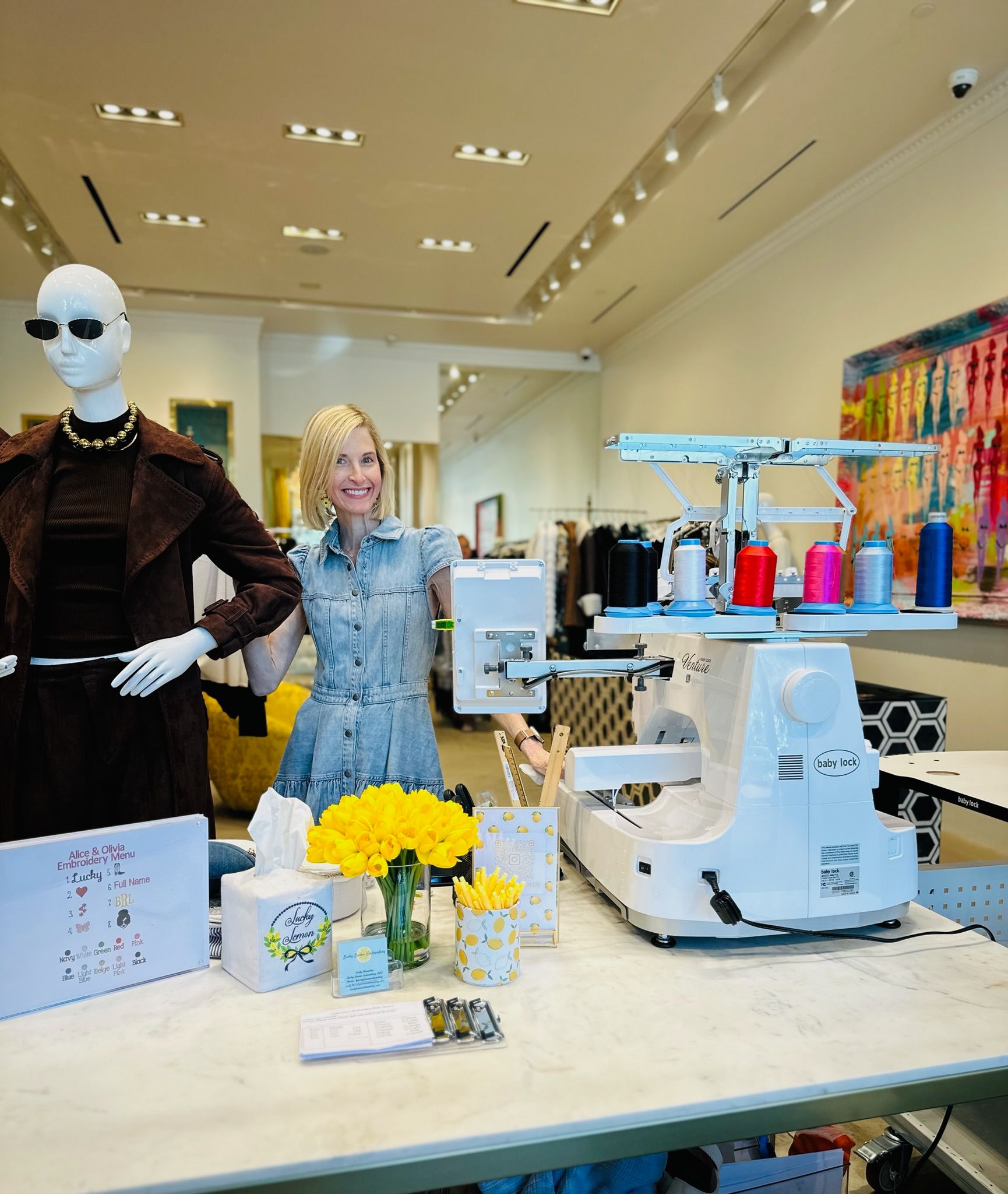 Emily stitching at an Alice + Olivia on-site event