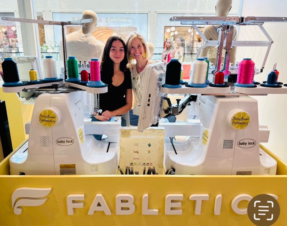Emily and Bianca from Lucky Lemon stitching on-site at Fabletics